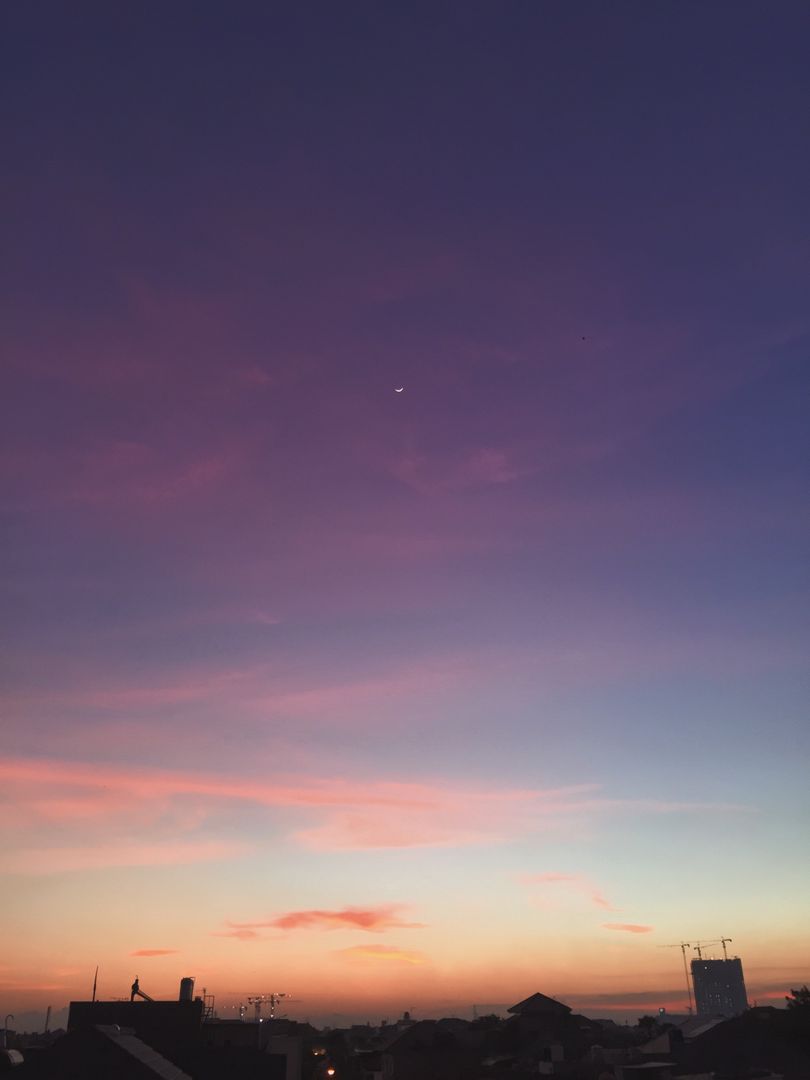 Majestic Sunset with Crescent Moon Over Urban Skyline - Free Images, Stock Photos and Pictures on Pikwizard.com