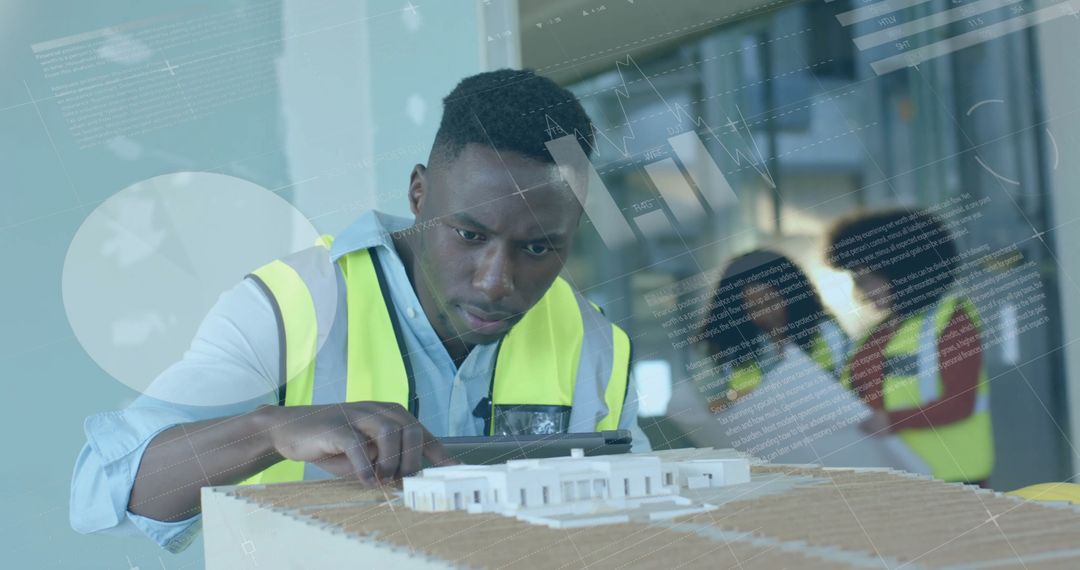 Architect Examining Building Model with Team in Background