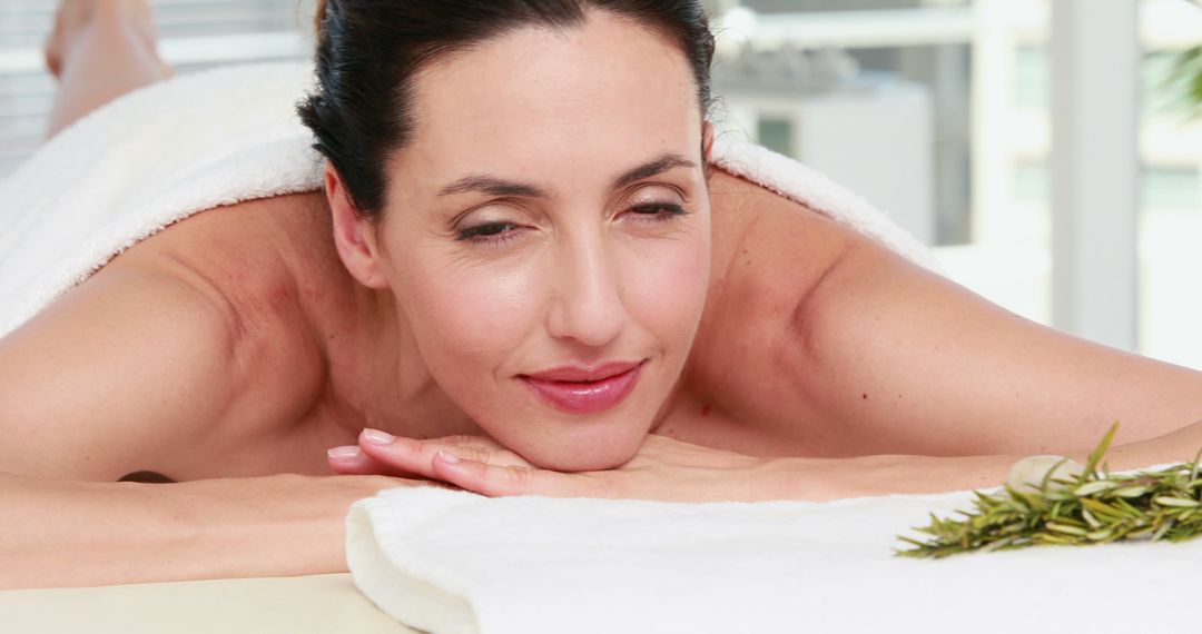 Woman Enjoying Relaxing Spa Treatment With Fresh Herb Details - Free Images, Stock Photos and Pictures on Pikwizard.com