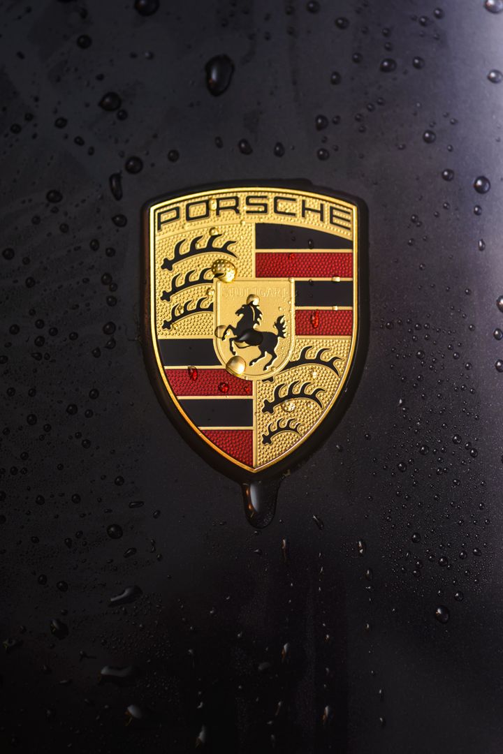 Close-up of Porsche badge - Free Images, Stock Photos and Pictures on Pikwizard.com