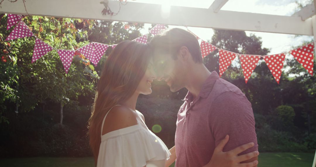 Romantic Couple Embracing Under Summer Sunlight - Free Images, Stock Photos and Pictures on Pikwizard.com