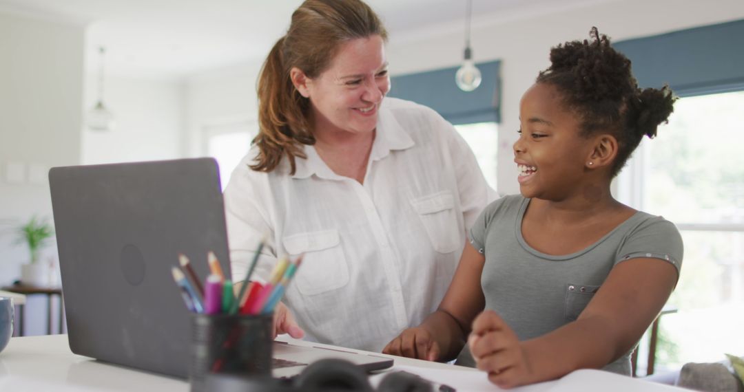 Mother and Daughter Enjoying Collaborative Homework Time