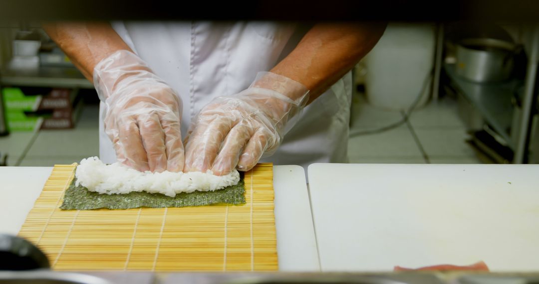 Chef Preparing Sushi Roll in Professional Kitchen - Free Images, Stock Photos and Pictures on Pikwizard.com