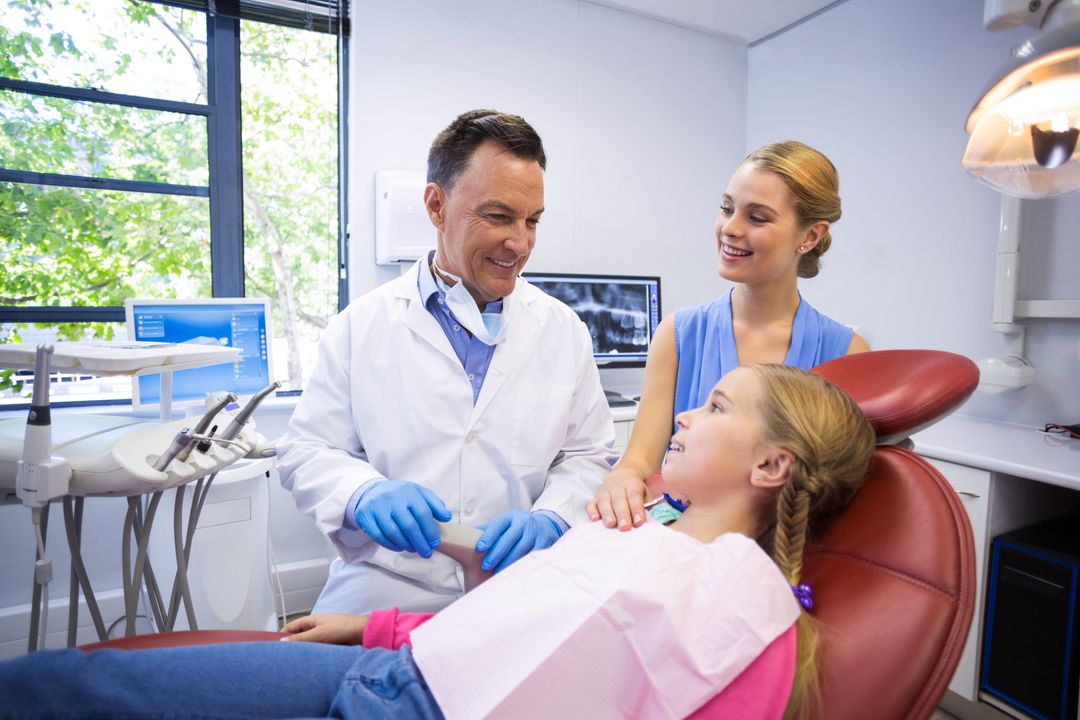 Dentist interacting with young patient - Free Images, Stock Photos and Pictures on Pikwizard.com