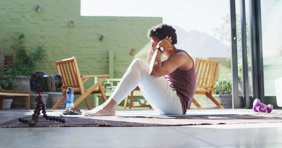 Fitness Enthusiast Filming Workout Routine at Home