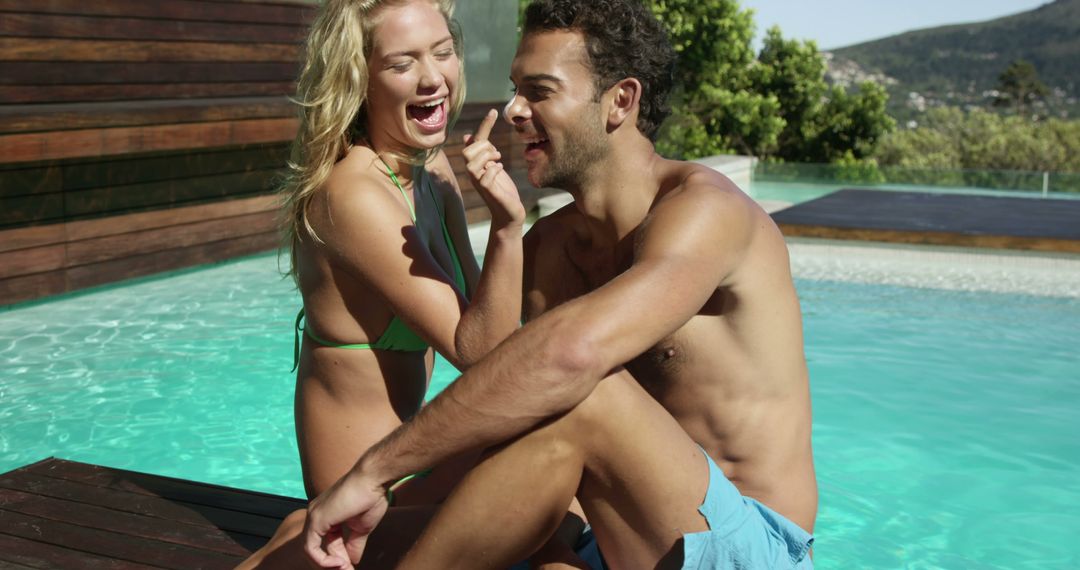 Happy Couple Relaxing by Tropical Poolside - Free Images, Stock Photos and Pictures on Pikwizard.com