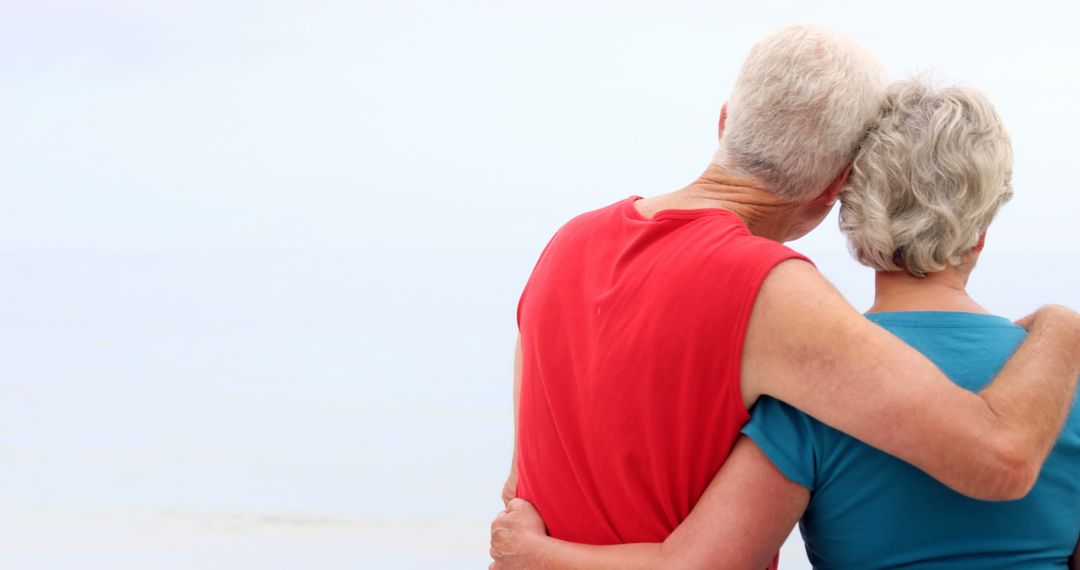 Senior Couple Embracing by Beach - Free Images, Stock Photos and Pictures on Pikwizard.com