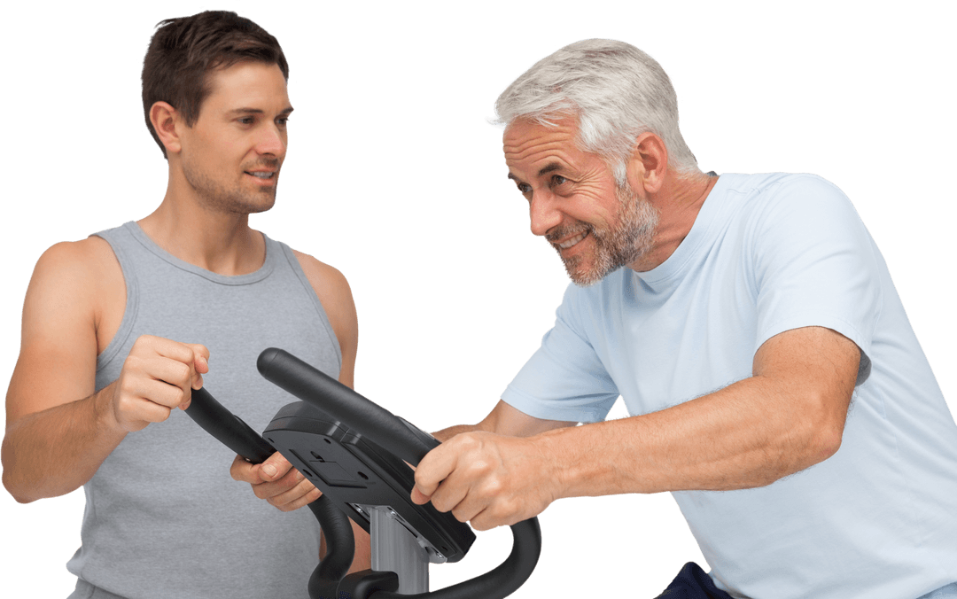 Mature Man Enthusiastically Cycling on Exercise Bike with Trainer