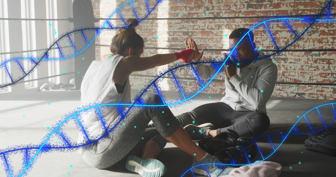 Two Women Practicing Boxing Interacting With Digital DNA Structure - Free Images, Stock Photos and Pictures on Pikwizard.com