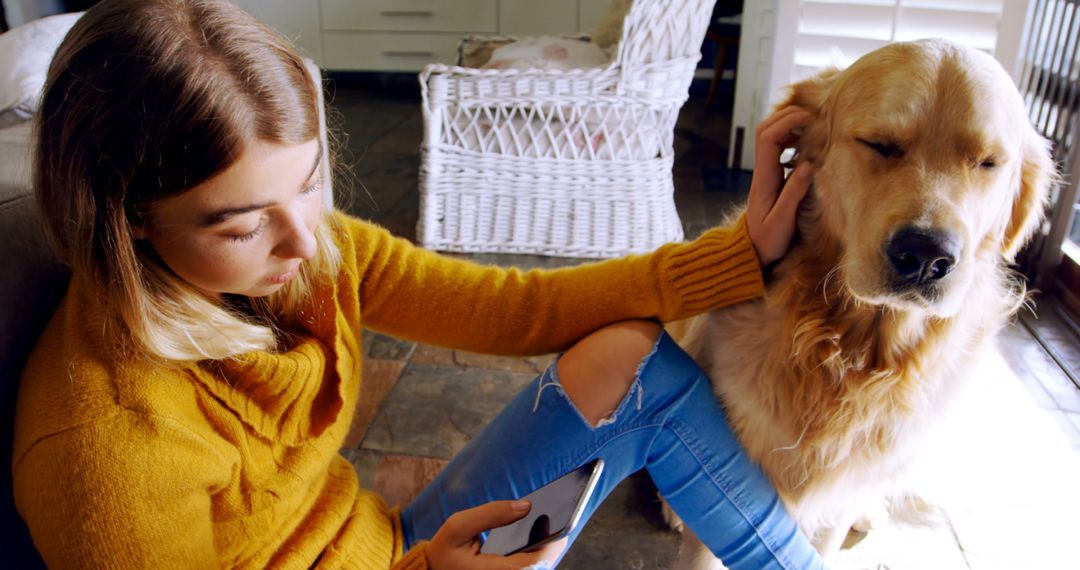 Young Woman Petting Golden Retriever in Cozy Home - Free Images, Stock Photos and Pictures on Pikwizard.com