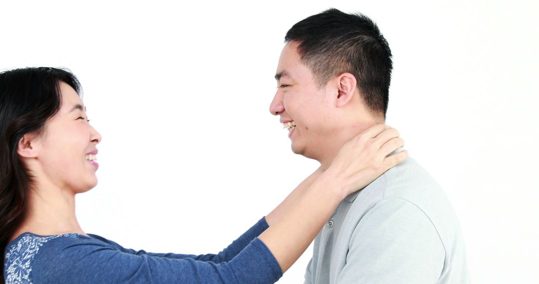 Joyful Interaction Between Couple Smiling at Each Other