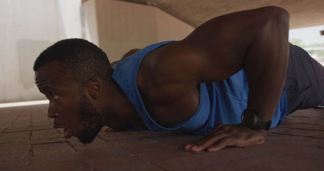 Focused Man Doing Push-Ups Under Urban Bridge - Free Images, Stock Photos and Pictures on Pikwizard.com