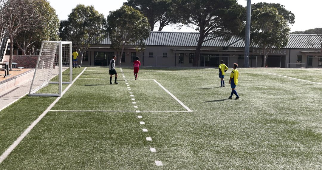 Youth Soccer Players Practicing on Artificial Turf Field