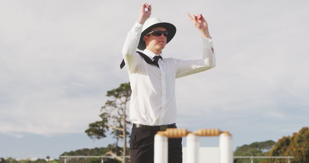 Cricket Umpire Signaling During a Match on Clear Day - Free Images, Stock Photos and Pictures on Pikwizard.com