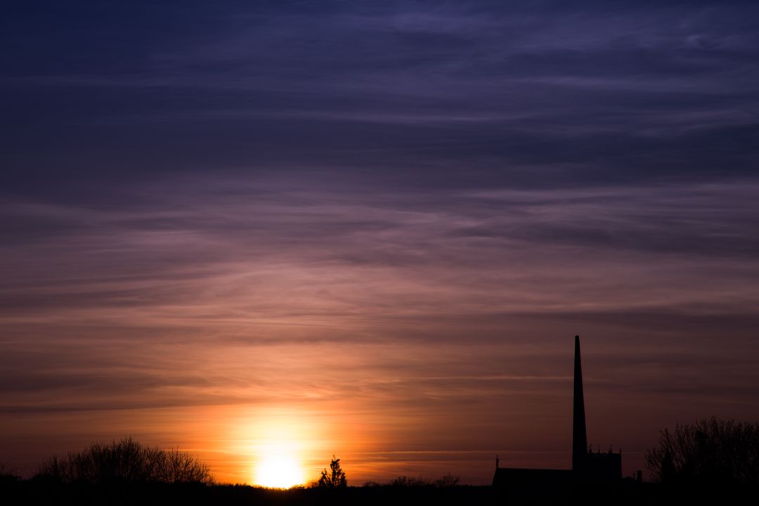 Stunning Sunset Over Silhouetted Urban Skyline - Free Images, Stock Photos and Pictures on Pikwizard.com