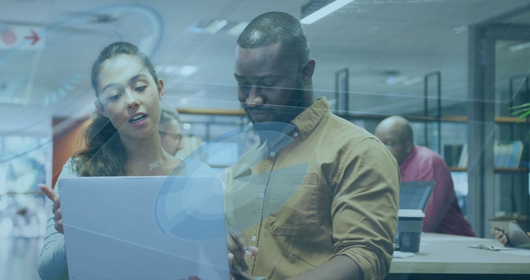 Diverse Team Collaborating with Digital Technology Interface Overlay