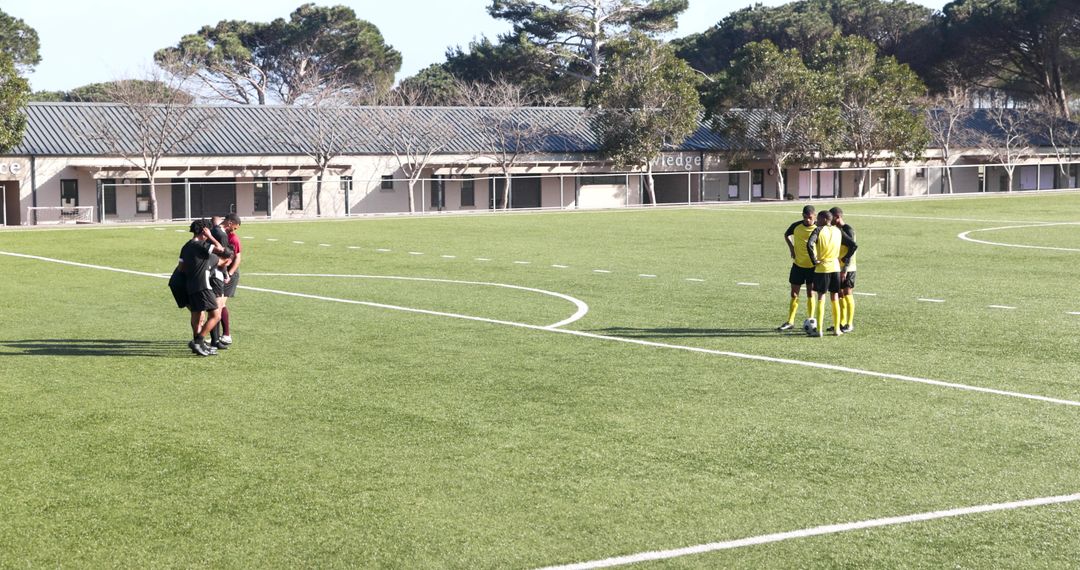 Soccer Teams Discussing Strategies Before Friendly Match