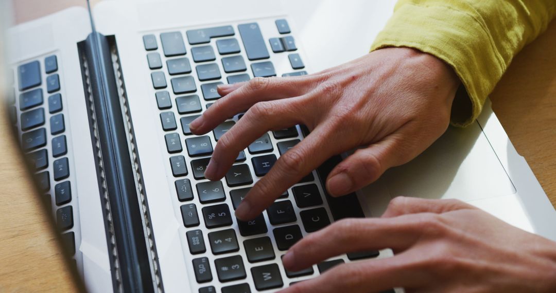 Close-Up of Hands Typing on Laptop Keyboard in Office - Free Images, Stock Photos and Pictures on Pikwizard.com