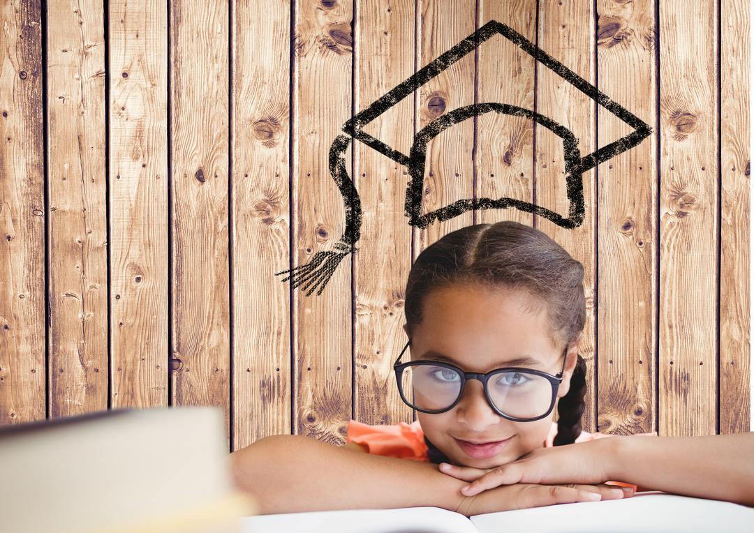 Young Girl with Glasses Resting on Book with Graduation Cap Drawing on Wooden Background - Free Images, Stock Photos and Pictures on Pikwizard.com