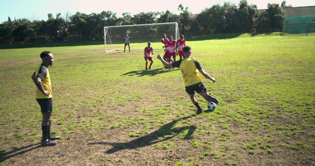 Young Soccer Players Taking Free Kick on Community Field