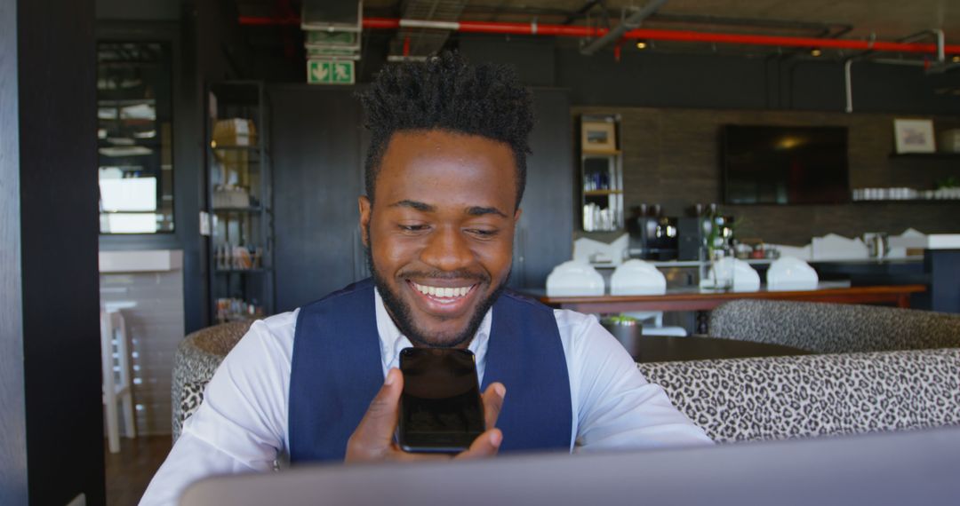 Smiling Businessman Using Smartphone in Office Café - Free Images, Stock Photos and Pictures on Pikwizard.com