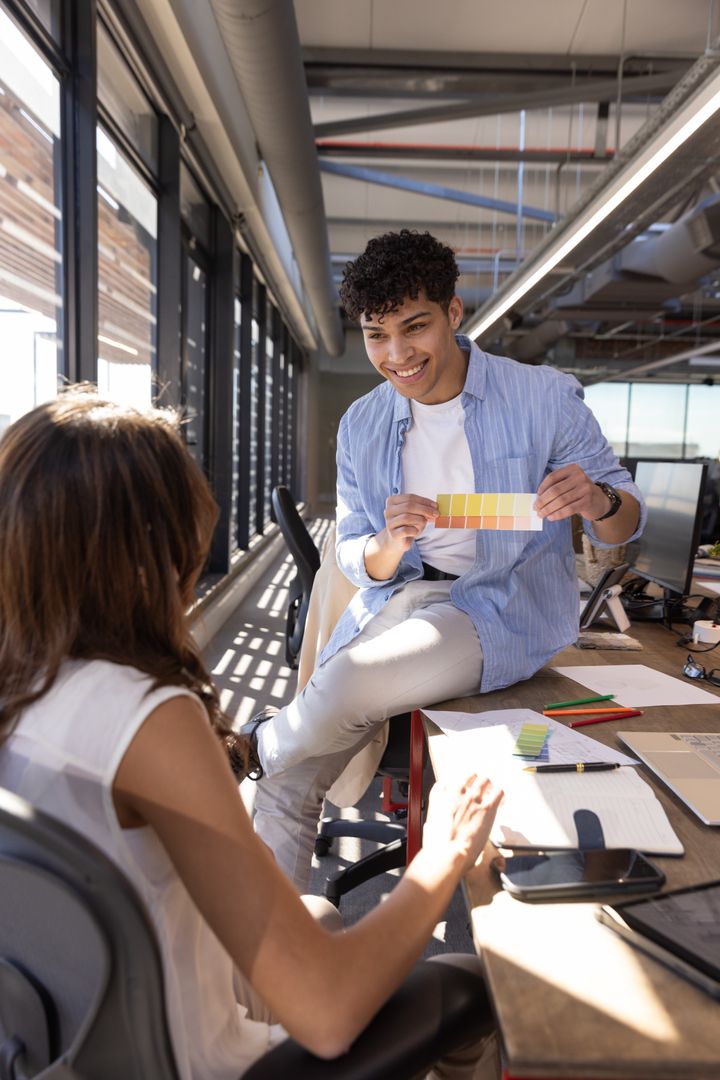 Colleagues Discussing Color Palette in Modern Design Office