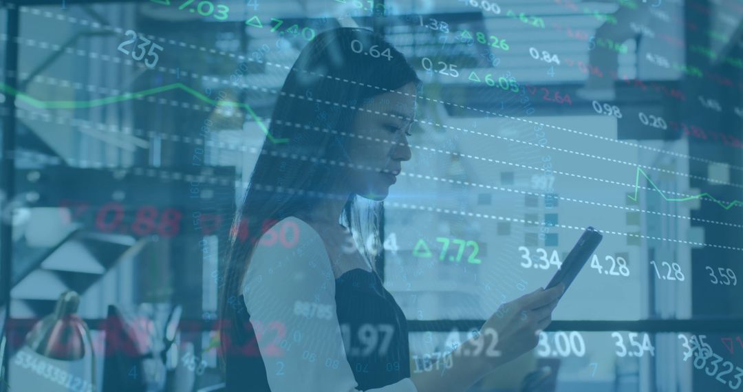 Asian Businesswoman Analyzing Financial Data on Tablet with Virtual Interface