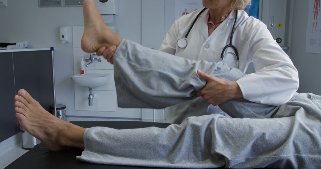 Physical Therapist Assisting Patient with Leg Exercise - Free Images, Stock Photos and Pictures on Pikwizard.com