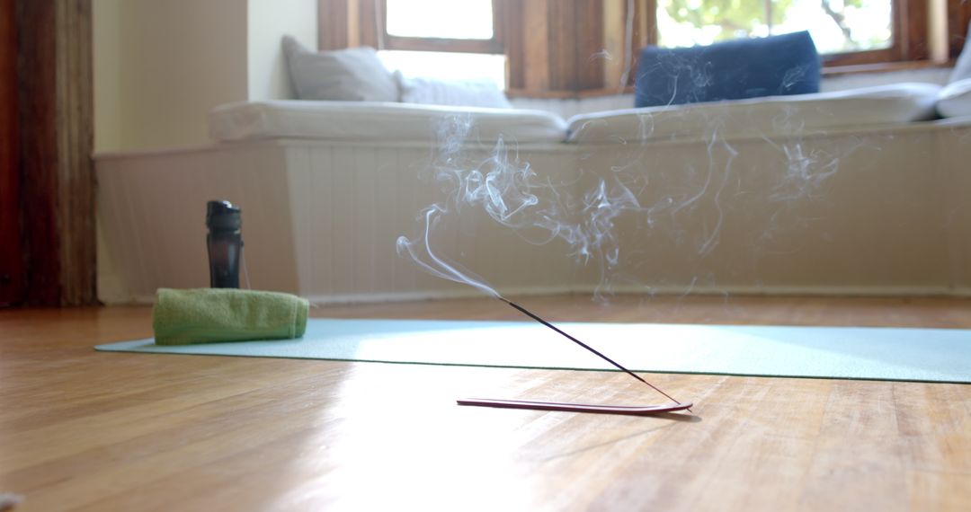 Incense Burning on Yoga Mat in Serene Home Sanctuary