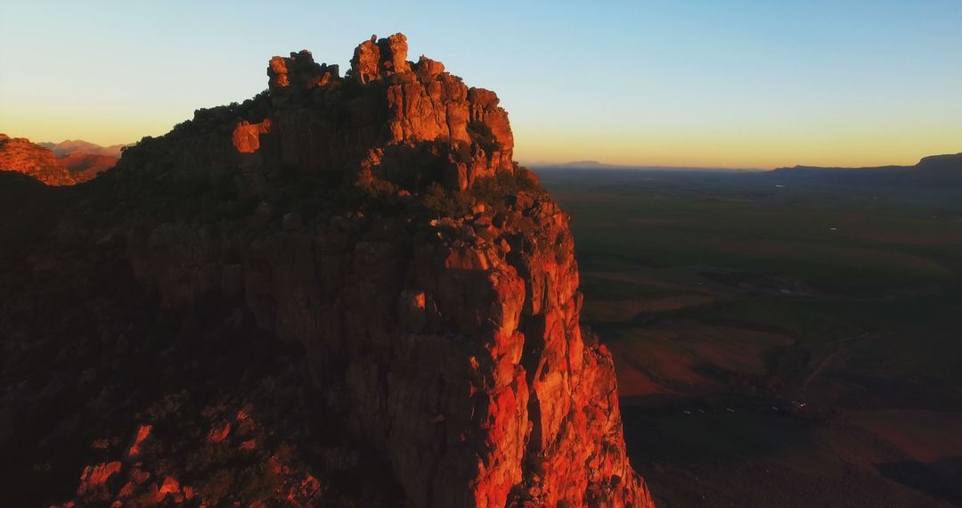 Dramatic Rock Formation at Sunset with Scenic Landscape - Free Images, Stock Photos and Pictures on Pikwizard.com