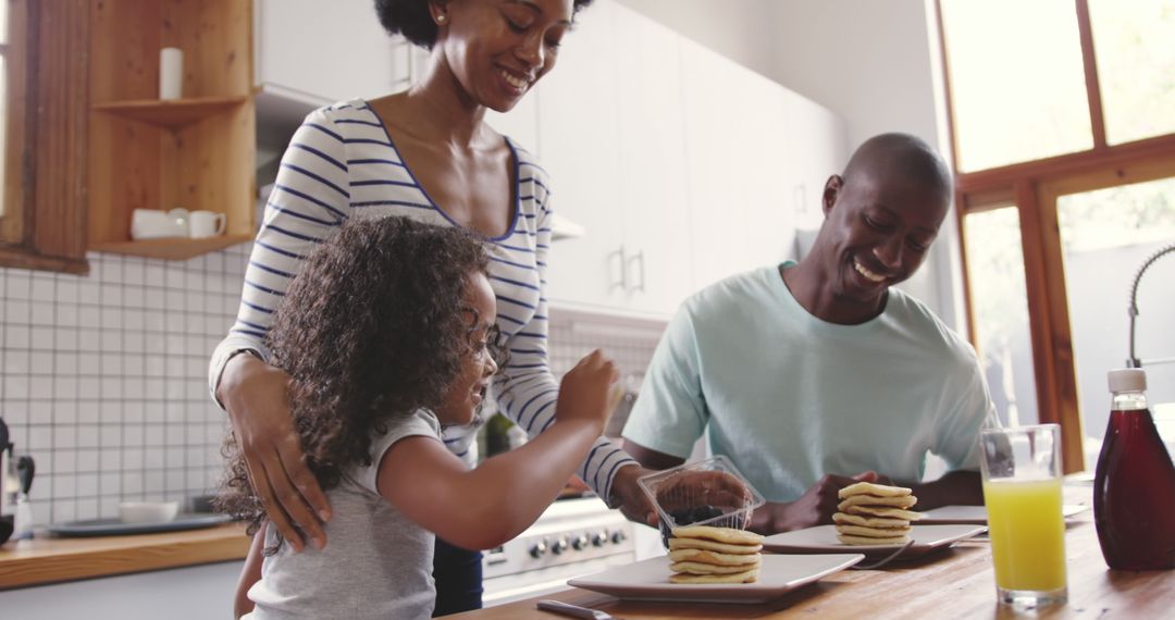 Happy African American Family Making Pancakes in Kitchen - Free Images, Stock Photos and Pictures on Pikwizard.com