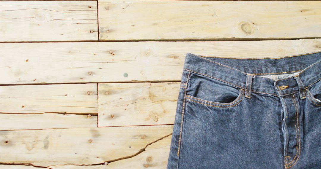 Blue Jeans on Wooden Surface, Room for Copy Space
