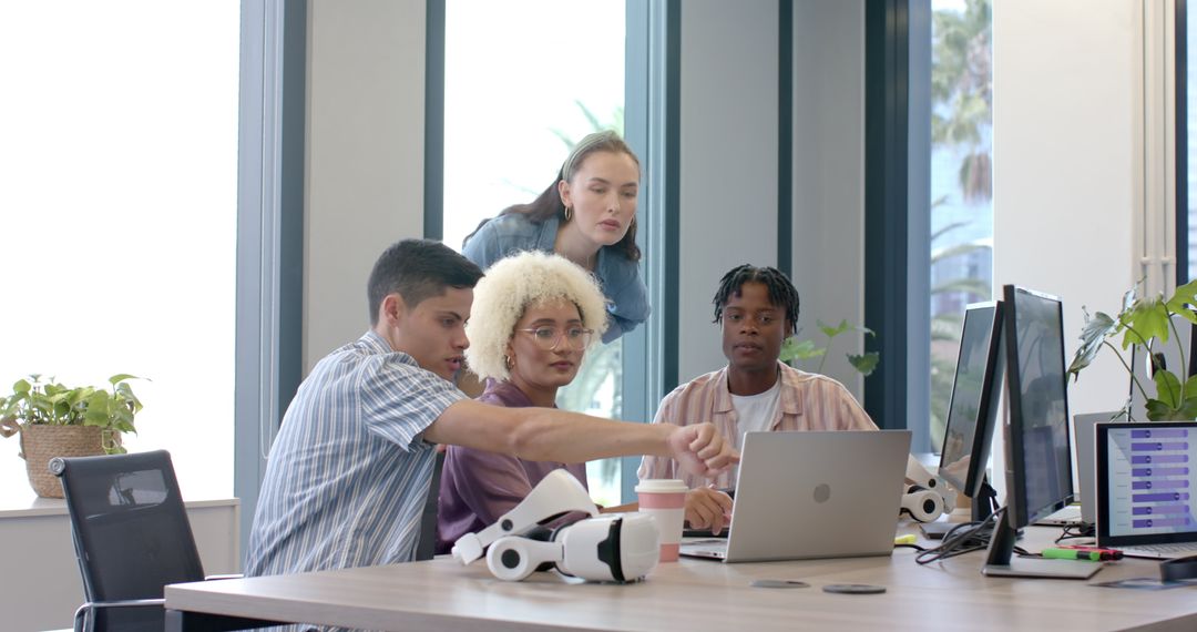 Diverse Team Engaging with VR Technology in Modern Office