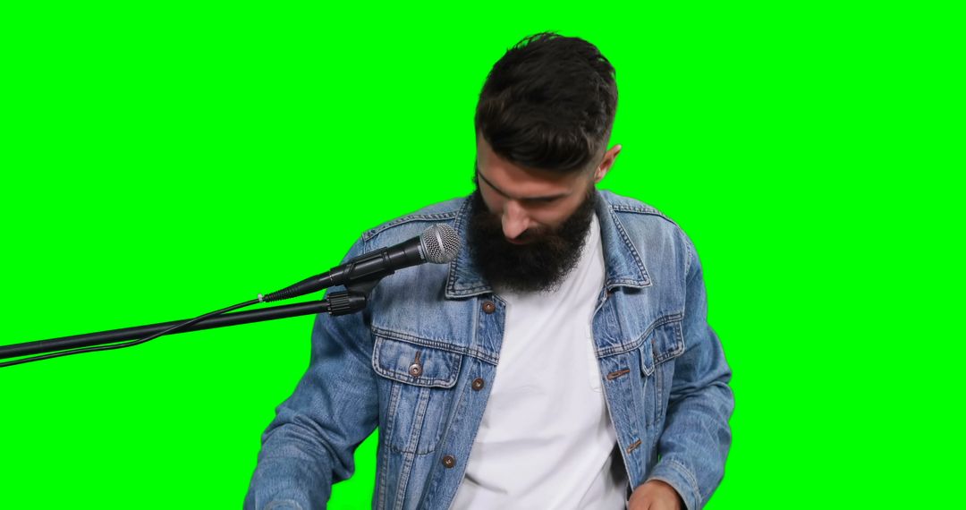 Man with Beard Using Sound Equipment, Isolated on Green Screen - Free Images, Stock Photos and Pictures on Pikwizard.com