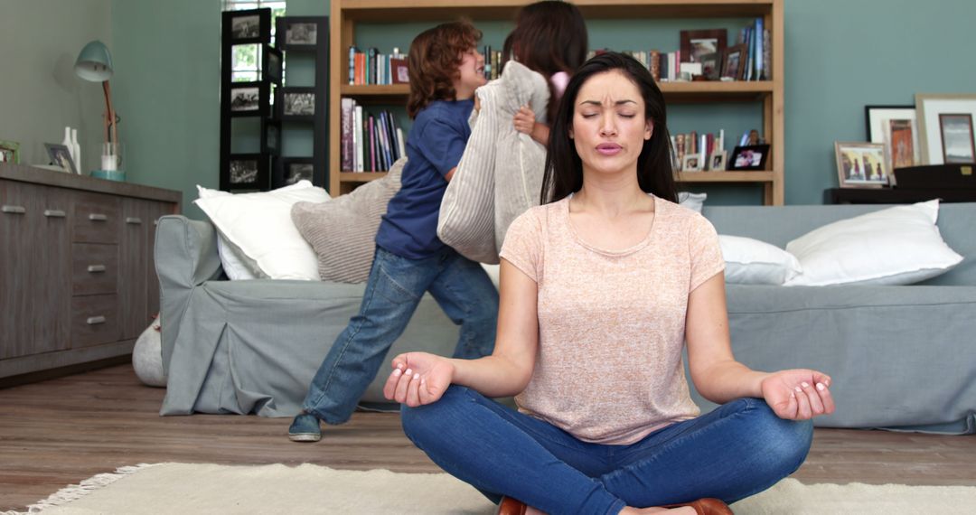 Mother Meditating While Children Playing in Living Room - Free Images, Stock Photos and Pictures on Pikwizard.com