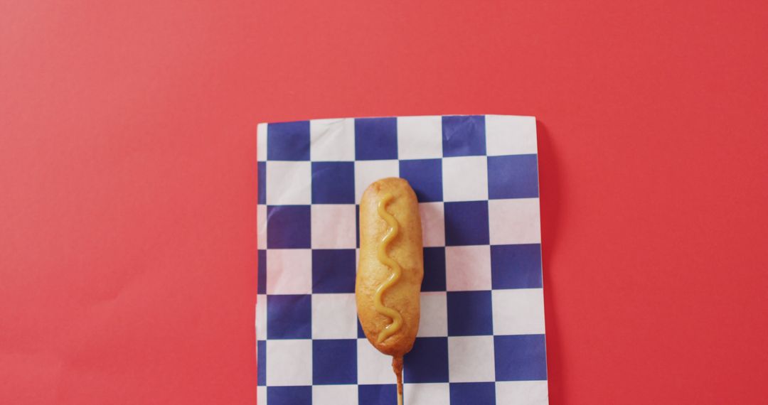 Corn Dog on Checkered Napkin with Red Background - Free Images, Stock Photos and Pictures on Pikwizard.com