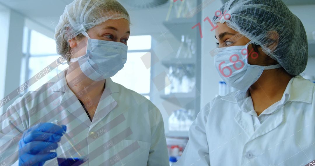 Women Scientists Analyzing Beaker with Digital Data Overlays
