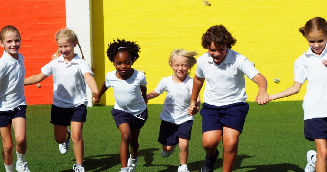 Excited School Children Running Outdoors on Sunny Day