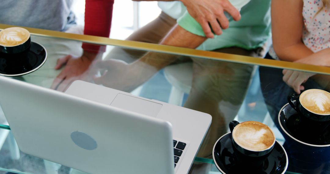 Group Friends Chatting Using Laptop Over Coffee at Cafe