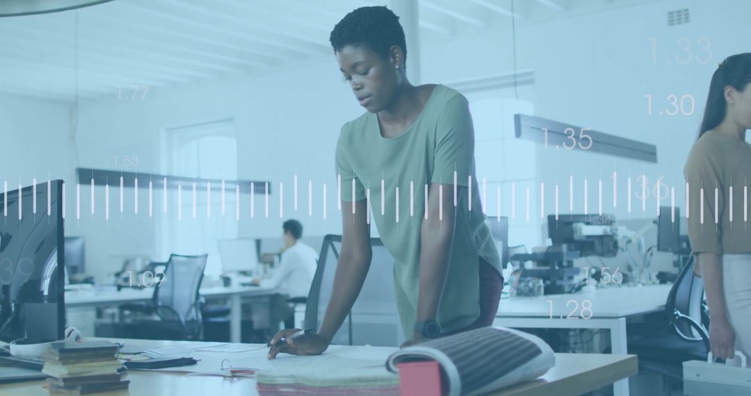 Financial Analytics with Diverse Team Collaborating in Modern Office