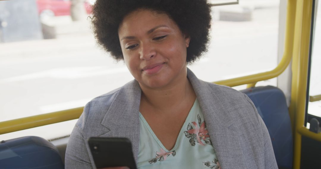 Smiling Plus Size Woman Using Smartphone on Public Bus