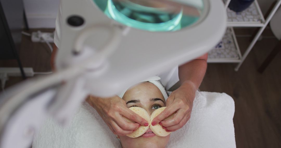 Woman Receiving Facial Massage with Sponges in Spa - Free Images, Stock Photos and Pictures on Pikwizard.com