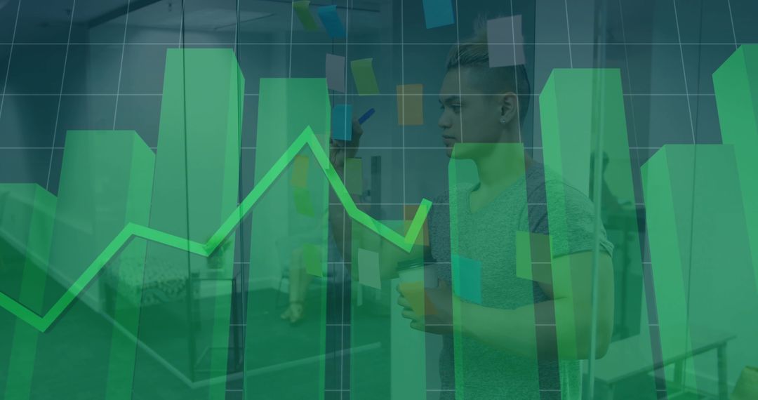 Young Professional Analyzing Data on Glass Wall with Sticky Notes, Bar Chart Overlay