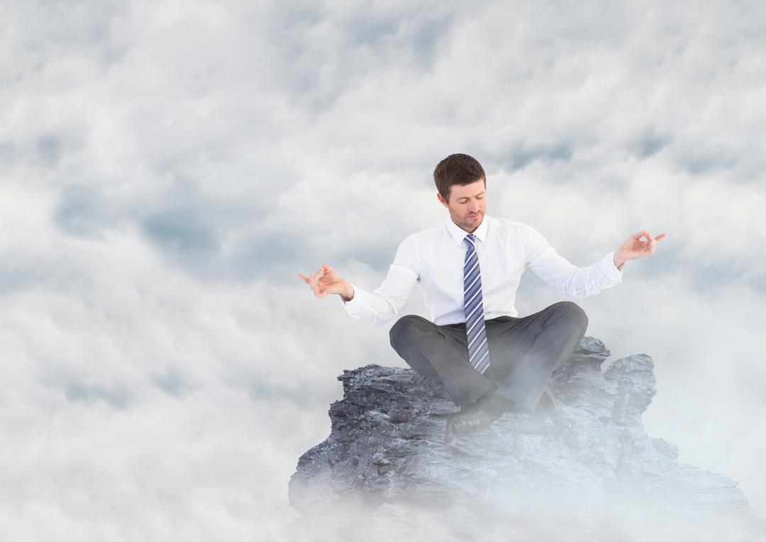Business man meditating on mountain peak in the clouds - Free Images, Stock Photos and Pictures on Pikwizard.com