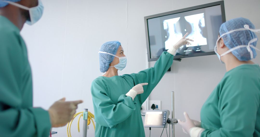 Surgeons Analyzing X-ray in Operating Room for Medical Precision