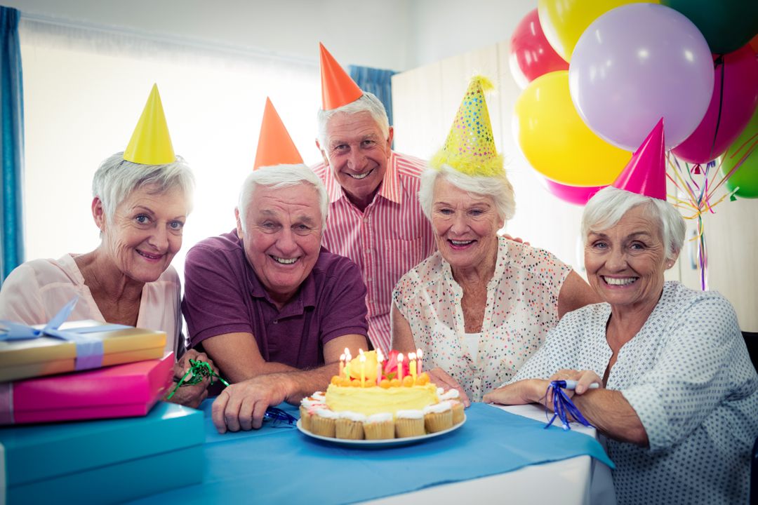 Group of seniors celebrating a birthday - Free Images, Stock Photos and Pictures on Pikwizard.com