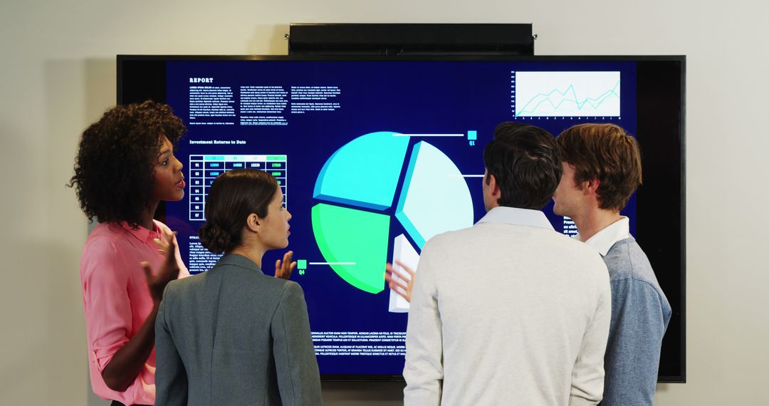 Business Team Analyzing Data on Digital Screen in Meeting Room - Free Images, Stock Photos and Pictures on Pikwizard.com