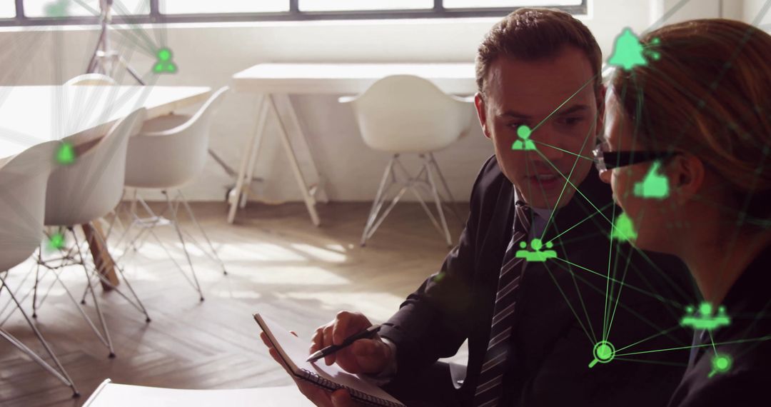 Business Professionals Analyzing Digital Networks in Modern Office