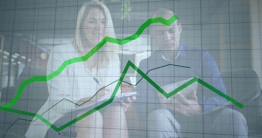 Business Professionals Analyzing Financial Graph and Market Data - Free Images, Stock Photos and Pictures on Pikwizard.com