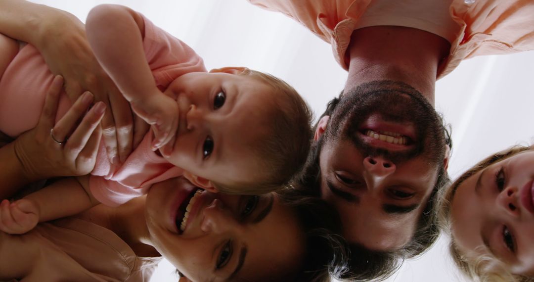 Happy Family Smiling and Playing Together - Free Images, Stock Photos and Pictures on Pikwizard.com